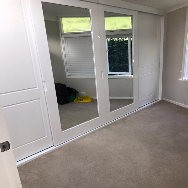 Polyurethane mirrored sliding doors with two panel doors