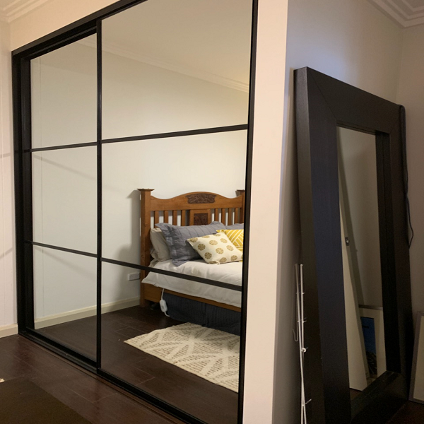Mirrored sliding doors with strips 