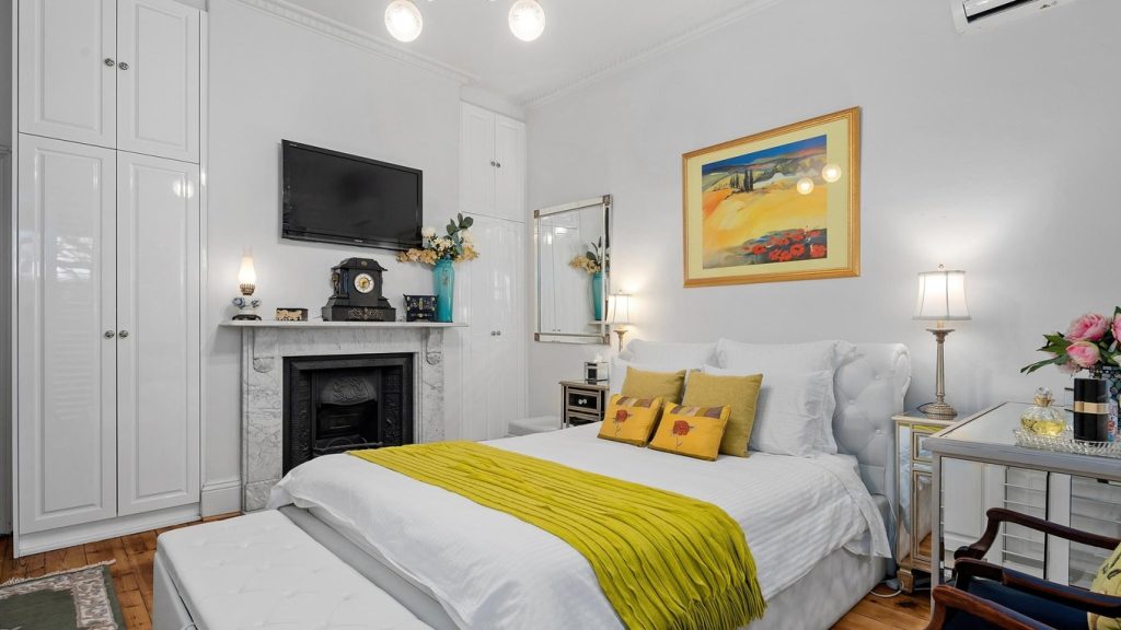 Hinged Wardrobes near fireplace 